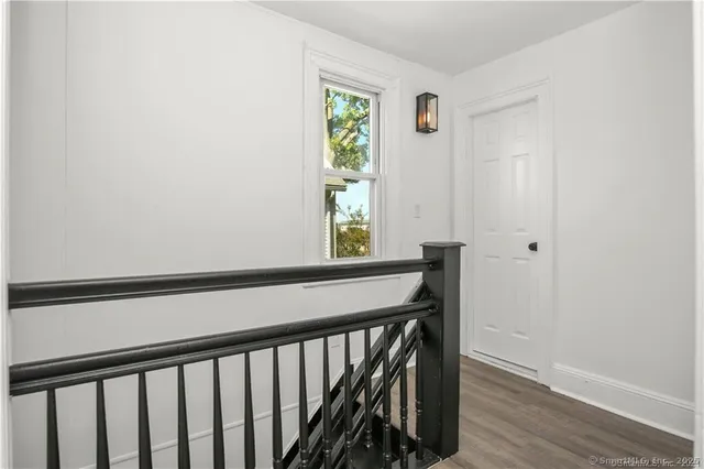 a bathroom with a toilet a sink and shower