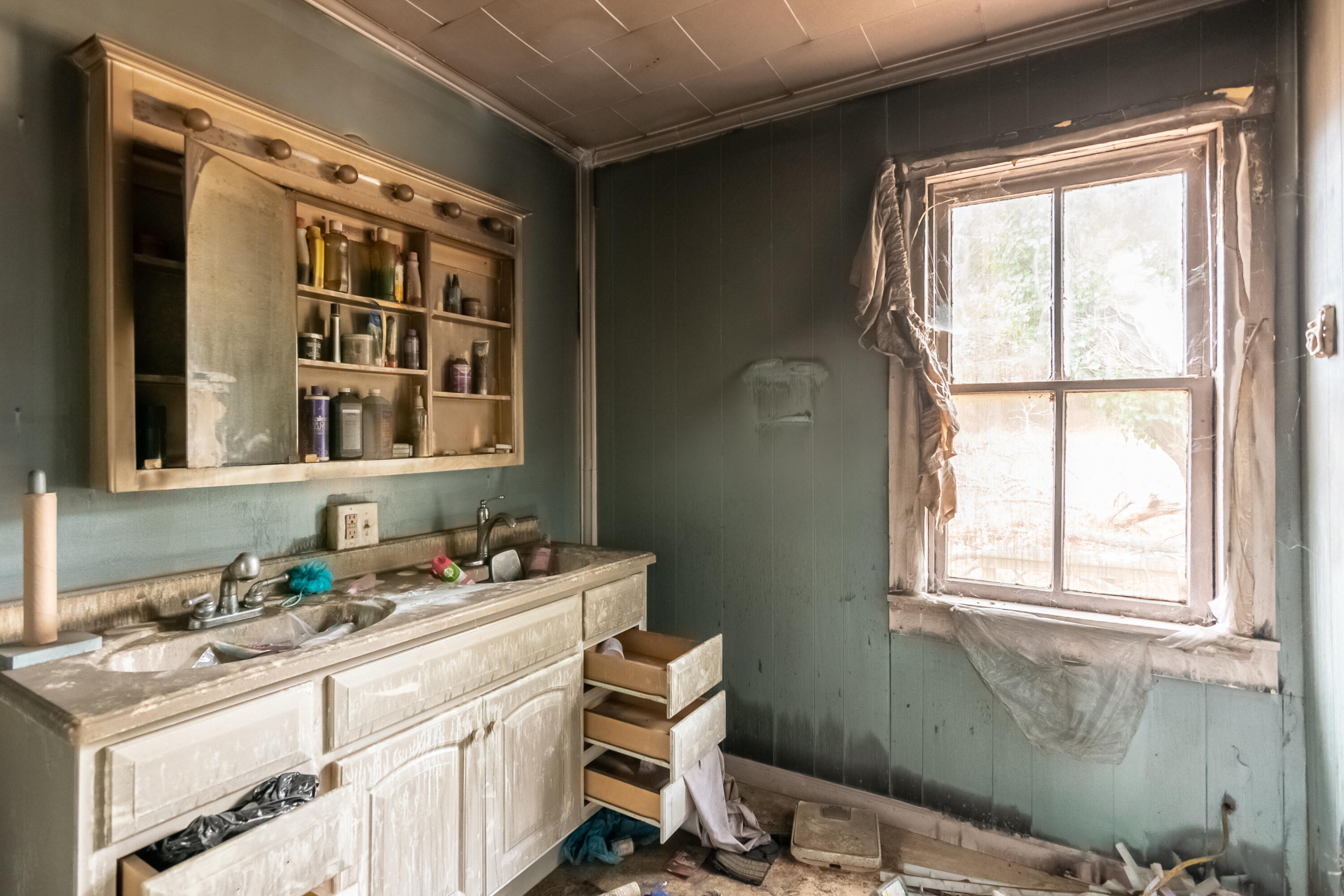142 Conner Grove Road Southwest Willis, VA 24380 - Photo 24 of 33 a bathroom with a sink window and a mirror