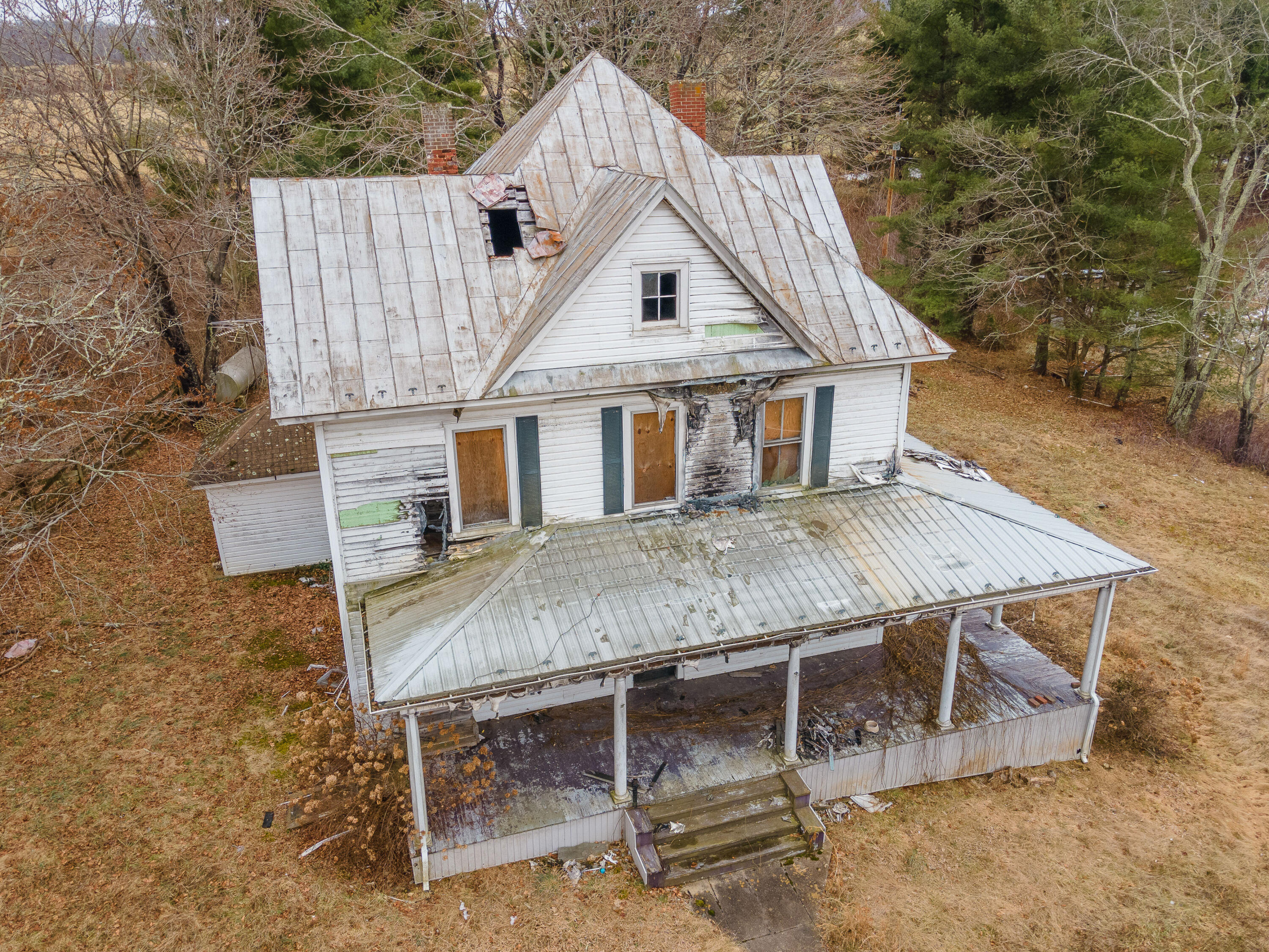 142 Conner Grove Road Southwest Willis, VA 24380 - Photo 8 of 33 a roof deck with table and chairs next to yard with wooden fence