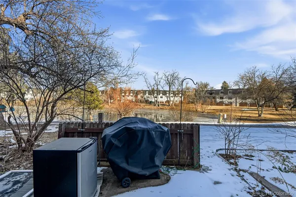 a view of a swimming pool and an outdoor seating