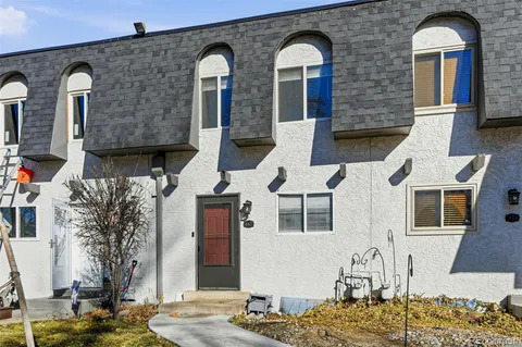 a front view of a house with large windows