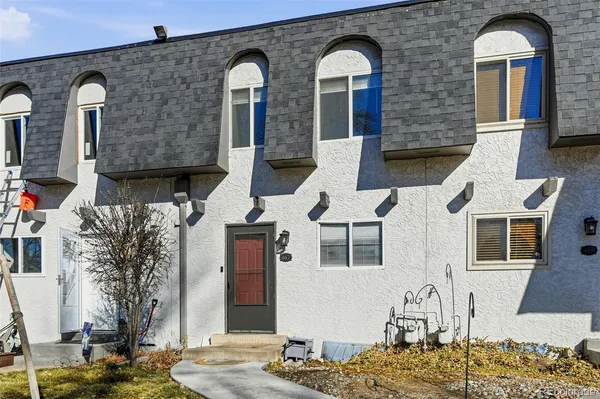 a front view of a house with large windows