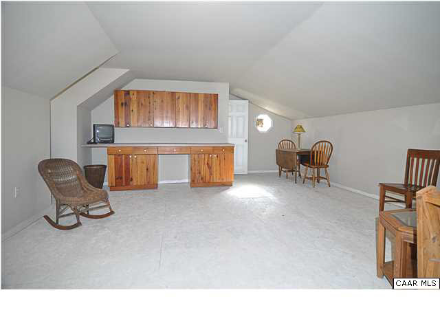 9057 Poindexter Road Louisa, VA 23093 - Photo 25 of 35 a living room with furniture and a couch