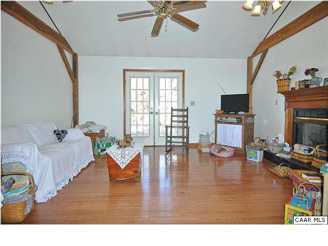 9057 Poindexter Road Louisa, VA 23093 - Photo 3 of 35 a living room with dining room and wooden floor