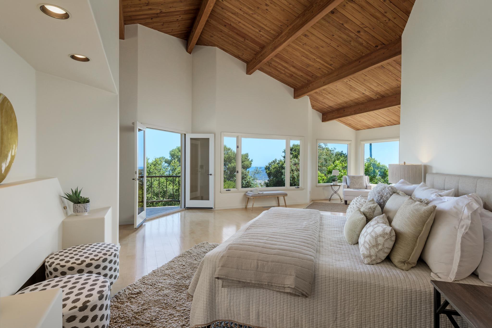 1235 Mission Ridge Road Santa Barbara, CA 93103 - Photo 14 of 27 a bedroom with furniture and a large window