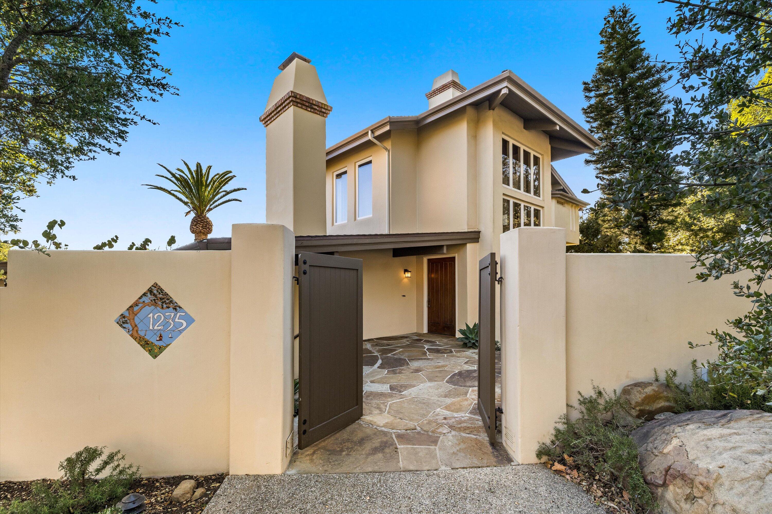 1235 Mission Ridge Road Santa Barbara, CA 93103 - Photo 22 of 27 a front view of a house with garden