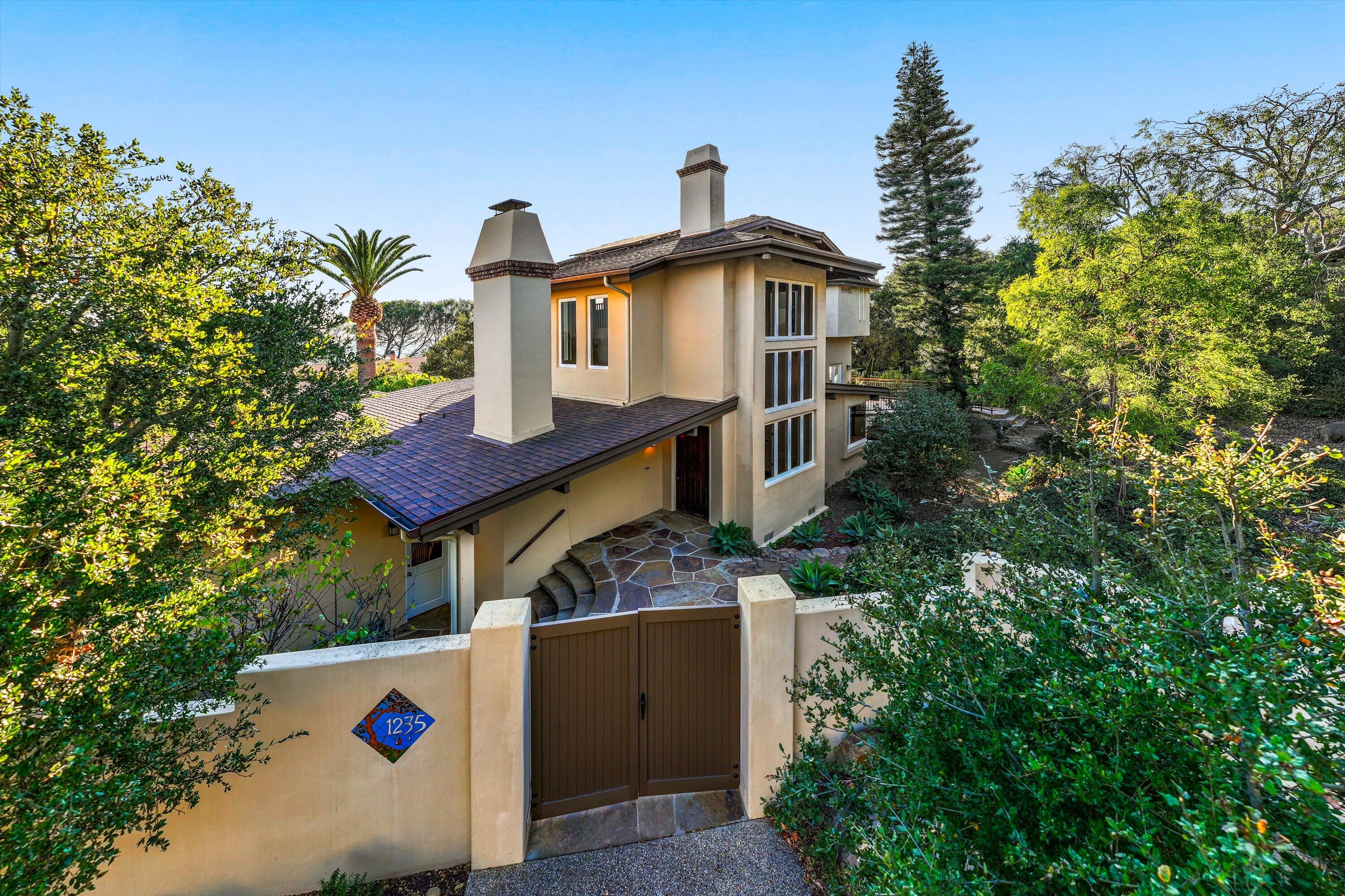 1235 Mission Ridge Road Santa Barbara, CA 93103 - Photo 4 of 27 a front view of a house with a yard