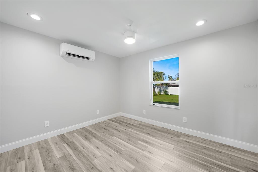 1450 New Point Comfort Road Englewood, FL 34223 - Photo 12 of 50 an empty room with windows
