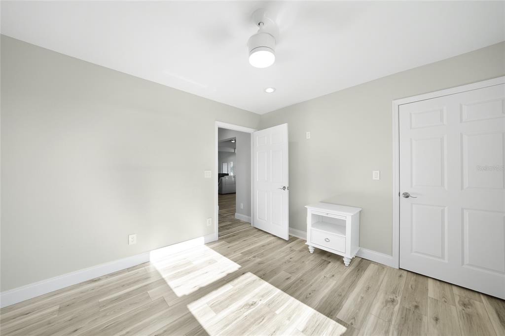 1450 New Point Comfort Road Englewood, FL 34223 - Photo 15 of 50 a view of an empty room and wooden floor