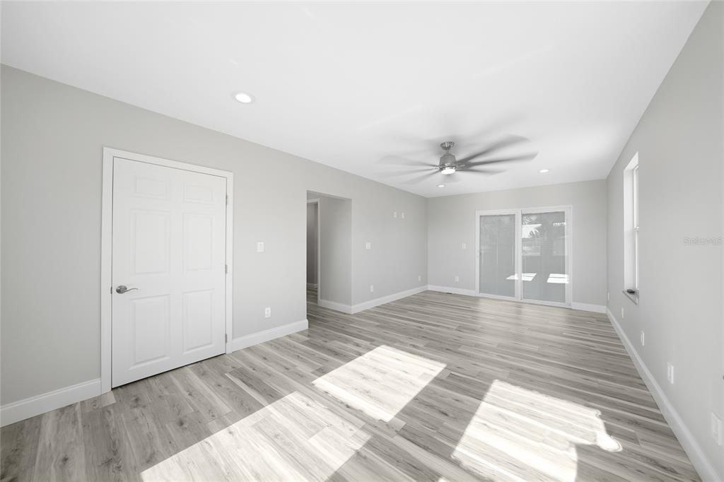 1450 New Point Comfort Road Englewood, FL 34223 - Photo 21 of 50 a view of wooden floor and windows in a room