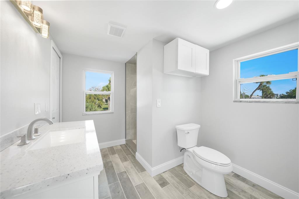 1450 New Point Comfort Road Englewood, FL 34223 - Photo 29 of 50 a bathroom with a sink and a toilet