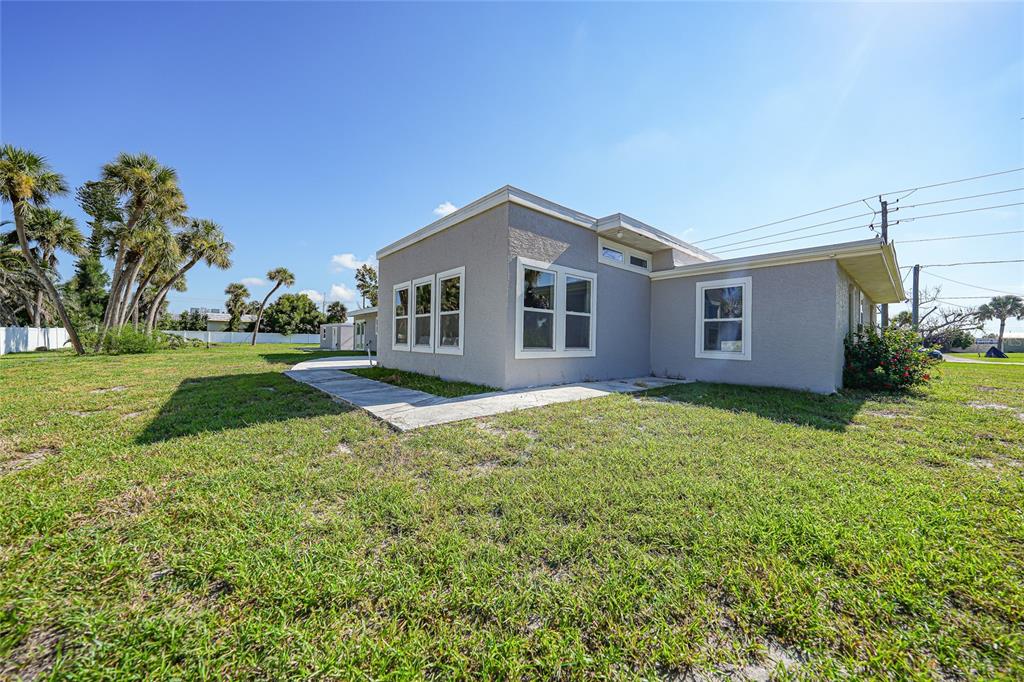 1450 New Point Comfort Road Englewood, FL 34223 - Photo 32 of 50 a front view of a house with garden
