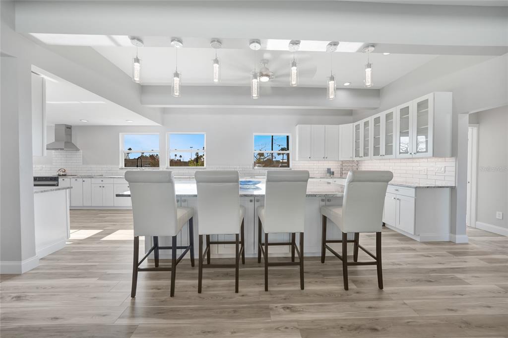 1450 New Point Comfort Road Englewood, FL 34223 - Photo 4 of 50 a view of a dining room with furniture and wooden floor