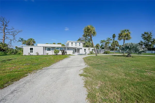 a view of a house with a big yard
