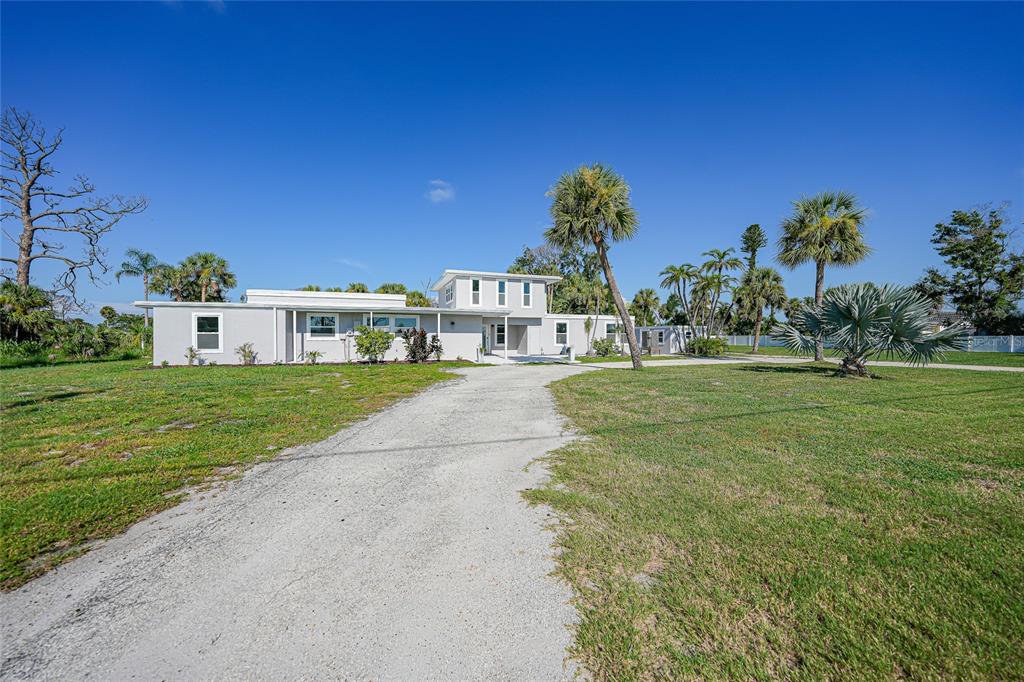 1450 New Point Comfort Road Englewood, FL 34223 - Photo 41 of 50 a view of a house with a big yard