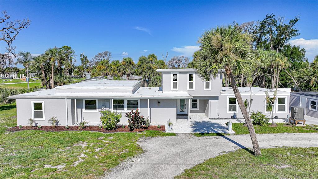 1450 New Point Comfort Road Englewood, FL 34223 - Photo 42 of 50 front view of a house with a yard