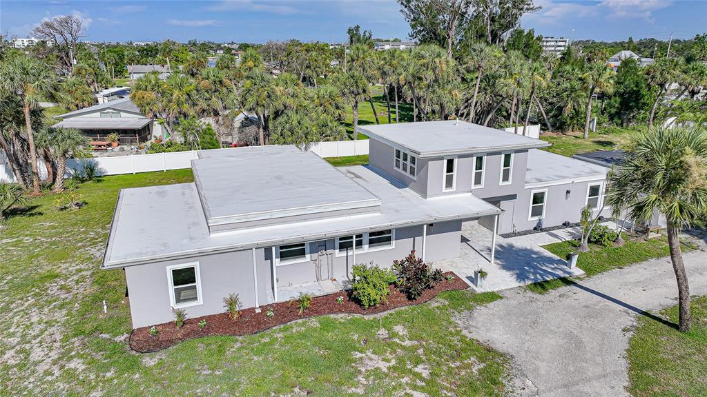 1450 New Point Comfort Road Englewood, FL 34223 - Photo 44 of 50 an aerial view of a house with a yard