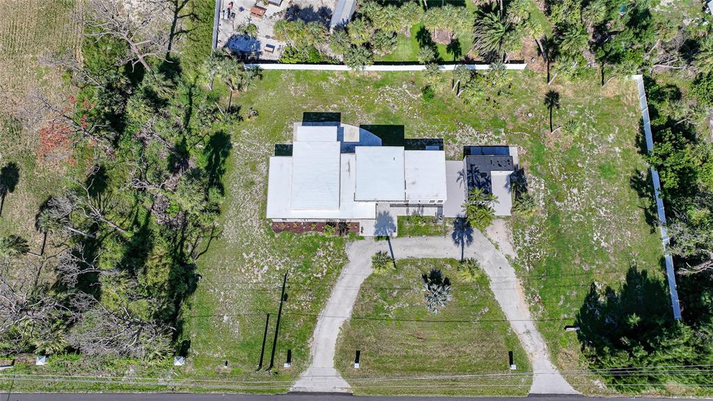 1450 New Point Comfort Road Englewood, FL 34223 - Photo 45 of 50 an aerial view of a house with a yard