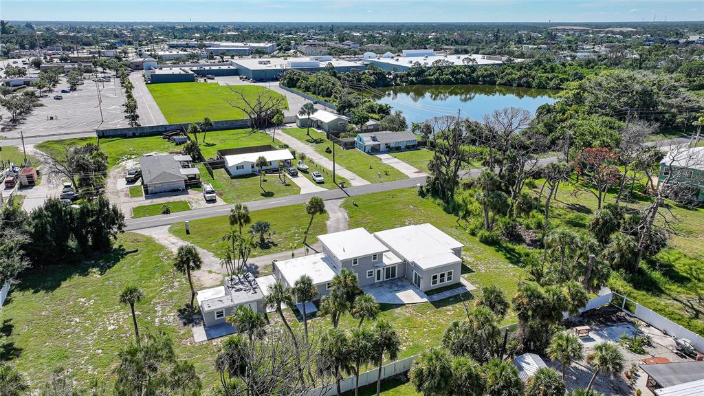 1450 New Point Comfort Road Englewood, FL 34223 - Photo 49 of 50 an aerial view of residential houses with outdoor space and lake view
