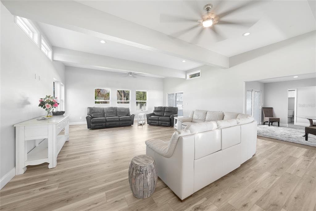 1450 New Point Comfort Road Englewood, FL 34223 - Photo 9 of 50 a living room with furniture and a wooden floor