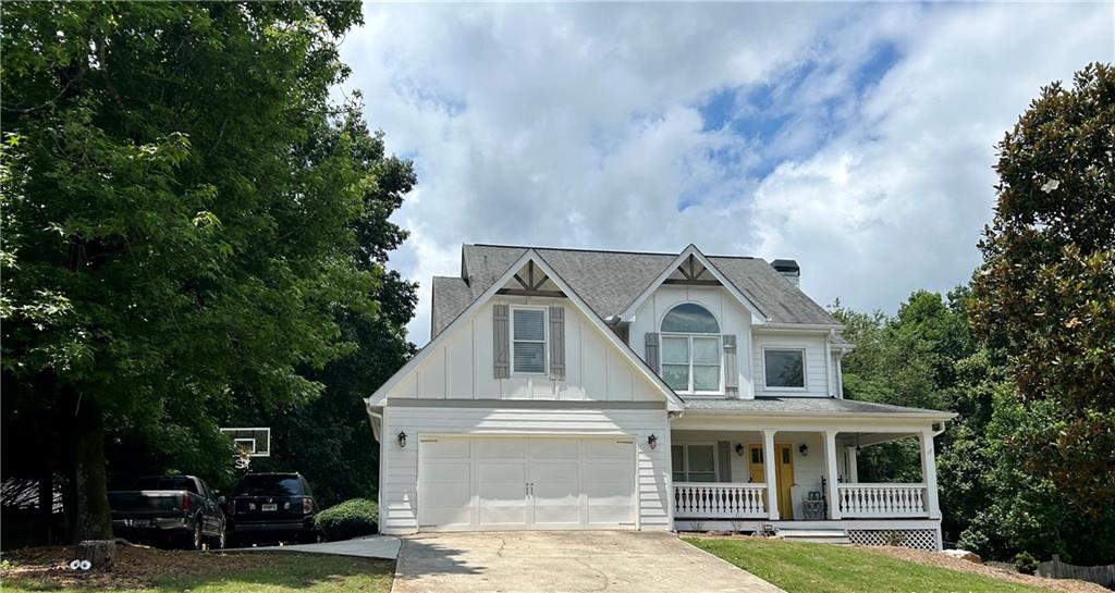336 Finch Way Jefferson, GA 30549 - Photo 1 of 1 a front view of a house with a garden