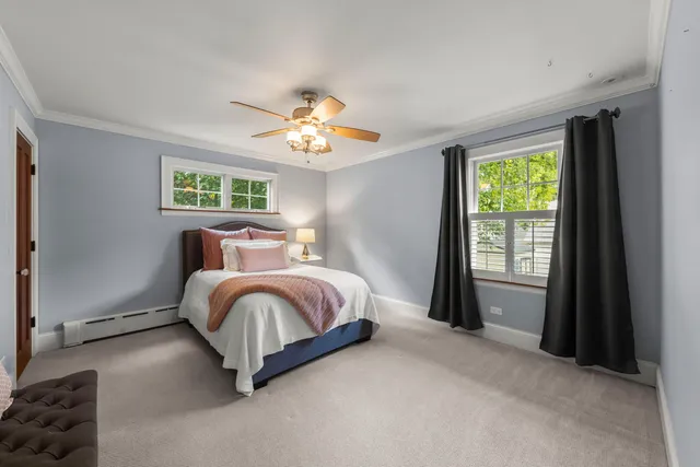 a spacious bedroom with a bed and a window