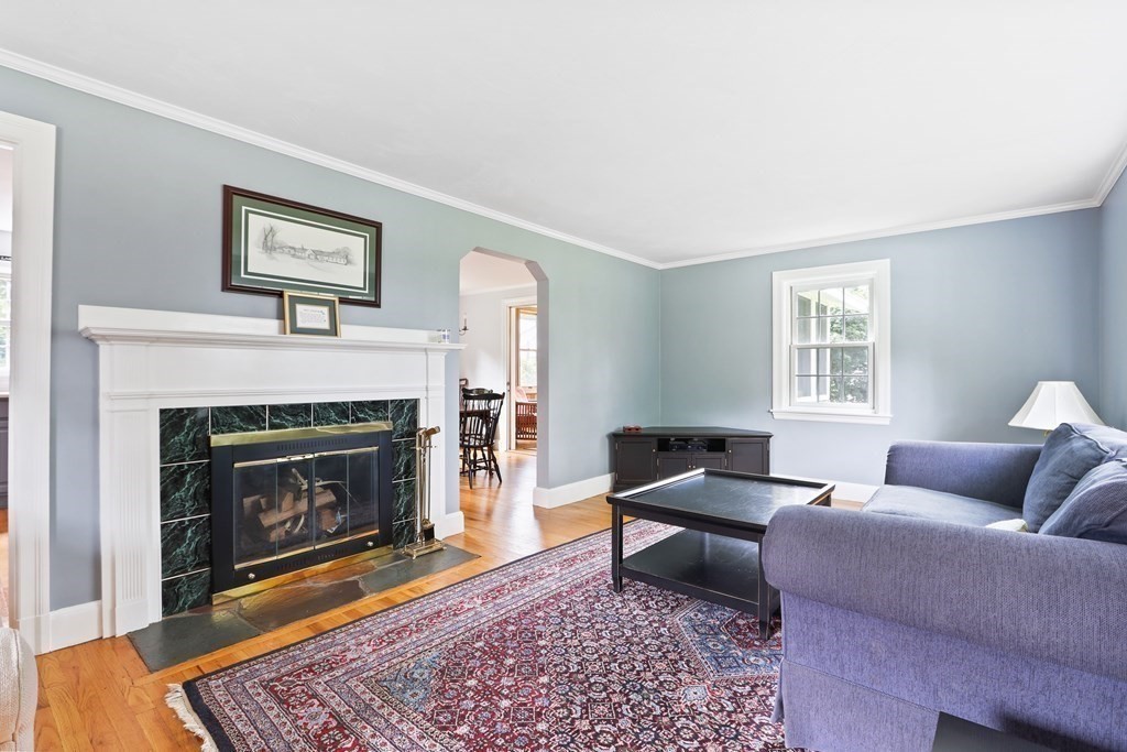 3 Overlook Road Needham, MA 02492 - Photo 15 of 32 a living room with furniture and a fireplace