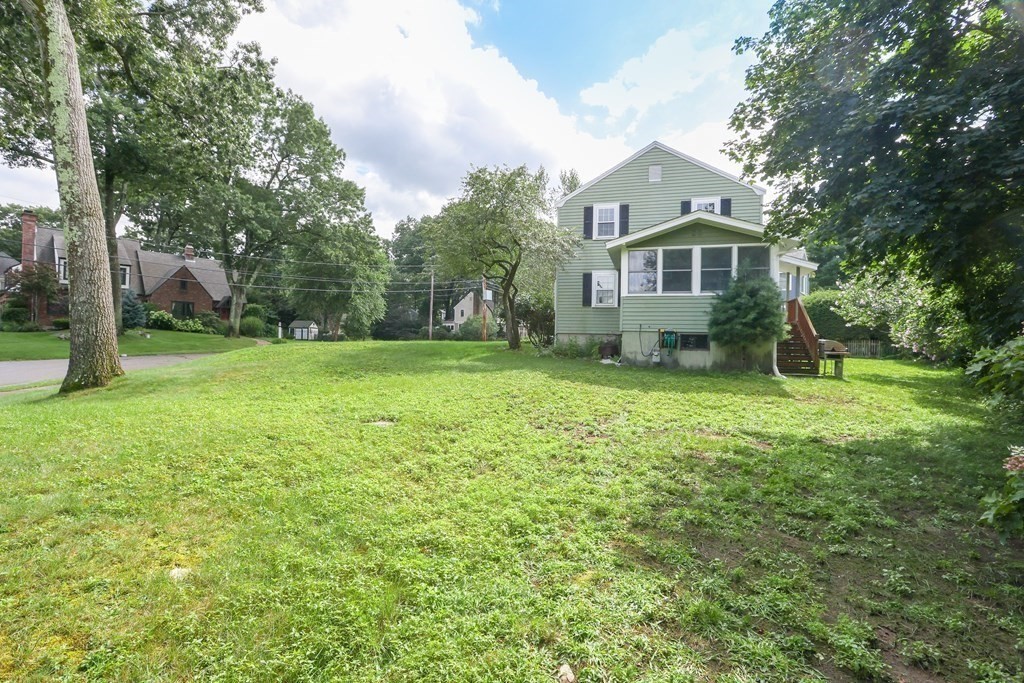 3 Overlook Road Needham, MA 02492 - Photo 31 of 32 a front view of a house with a yard and trees