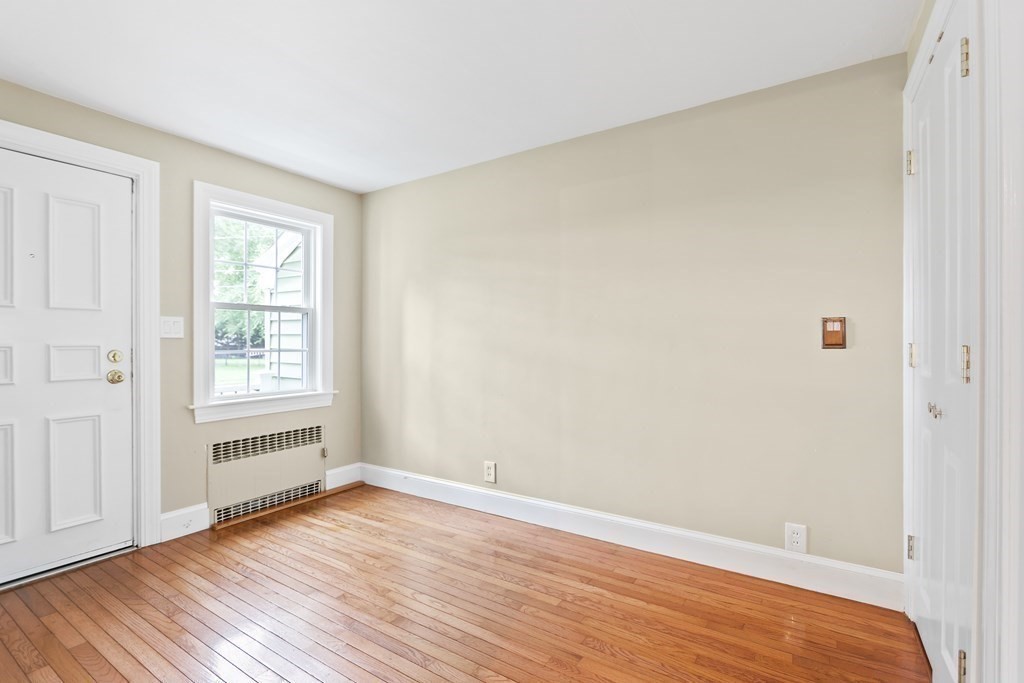 3 Overlook Road Needham, MA 02492 - Photo 4 of 32 a view of an empty room with wooden floor and a window