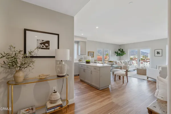 a kitchen with a sink stove and wooden cabinets