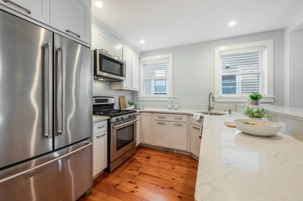 44 Roberts Road, Unit 2 Cambridge, MA 02138 - Photo 11 of 36 a kitchen with a refrigerator stove and sink
