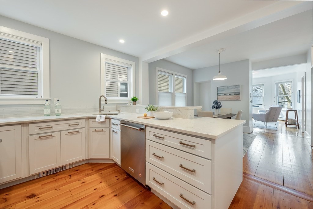 44 Roberts Road, Unit 2 Cambridge, MA 02138 - Photo 15 of 36 a spacious bathroom with a granite countertop sink mirror and a bath tub