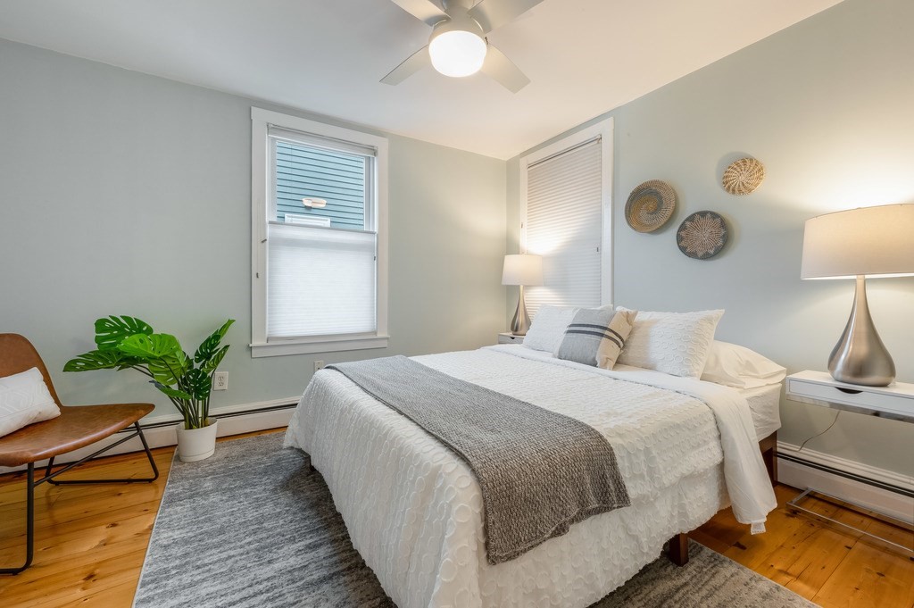 44 Roberts Road, Unit 2 Cambridge, MA 02138 - Photo 18 of 36 a bedroom with bed window and lamps