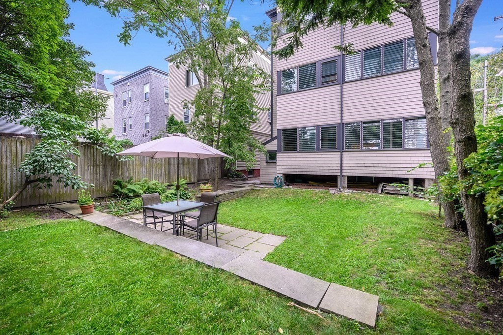 44 Roberts Road, Unit 2 Cambridge, MA 02138 - Photo 31 of 36 a view of a house with a backyard and sitting area
