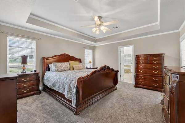 a bedroom with a bed and a dresser