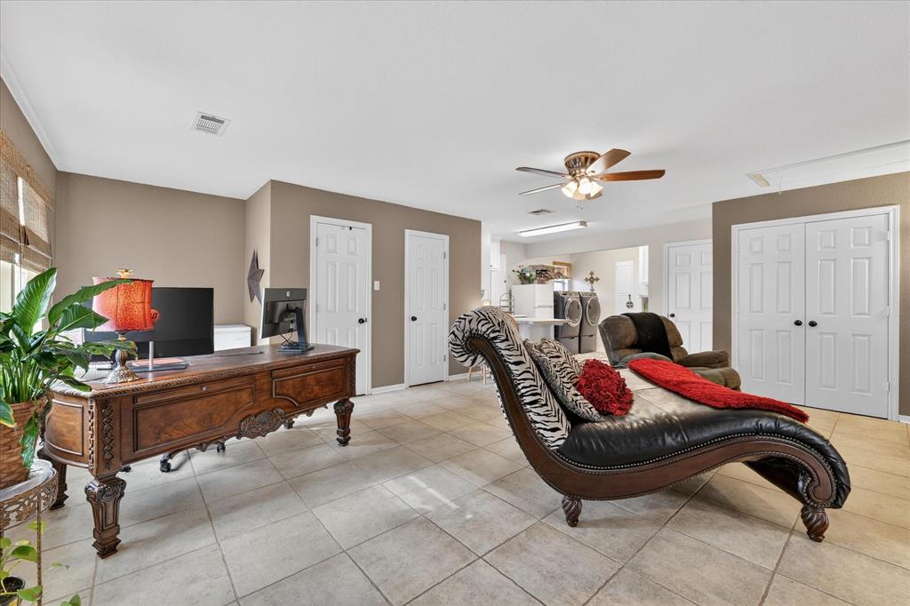 703 Gibraltar Lane Lorena, TX 76655 - Photo 18 of 39 a living room with furniture and a flat screen tv