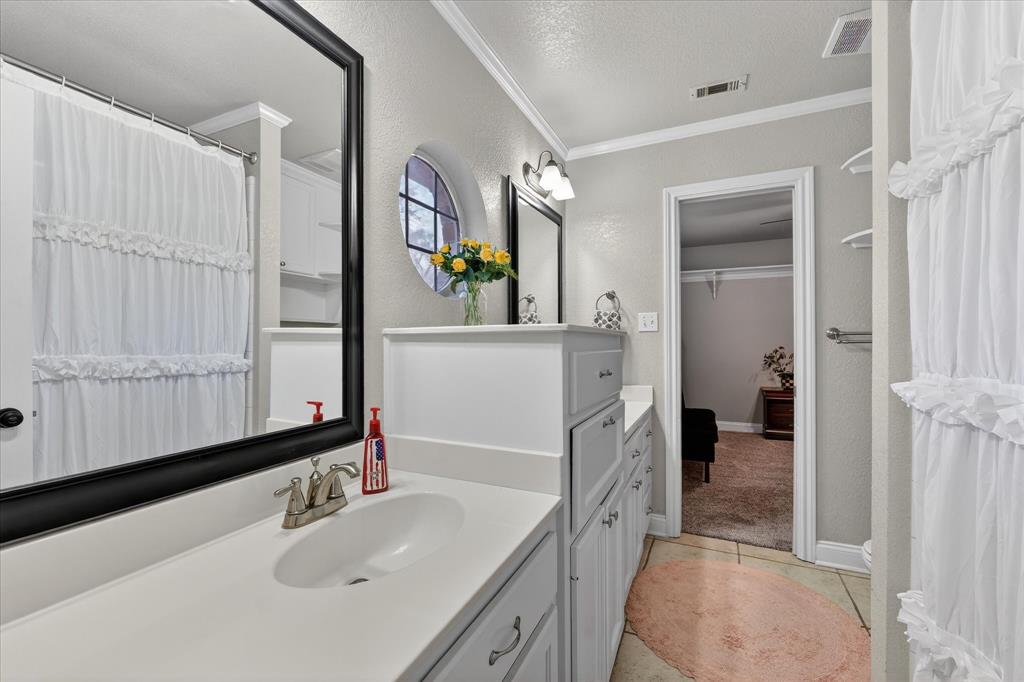703 Gibraltar Lane Lorena, TX 76655 - Photo 19 of 39 a bathroom with a sink and a mirror