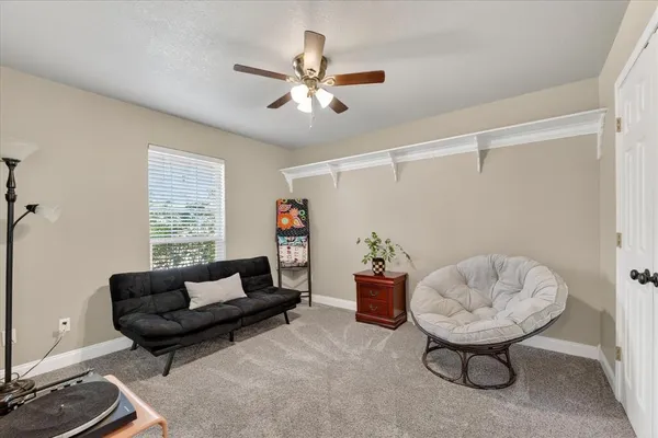 a living room with furniture and a window