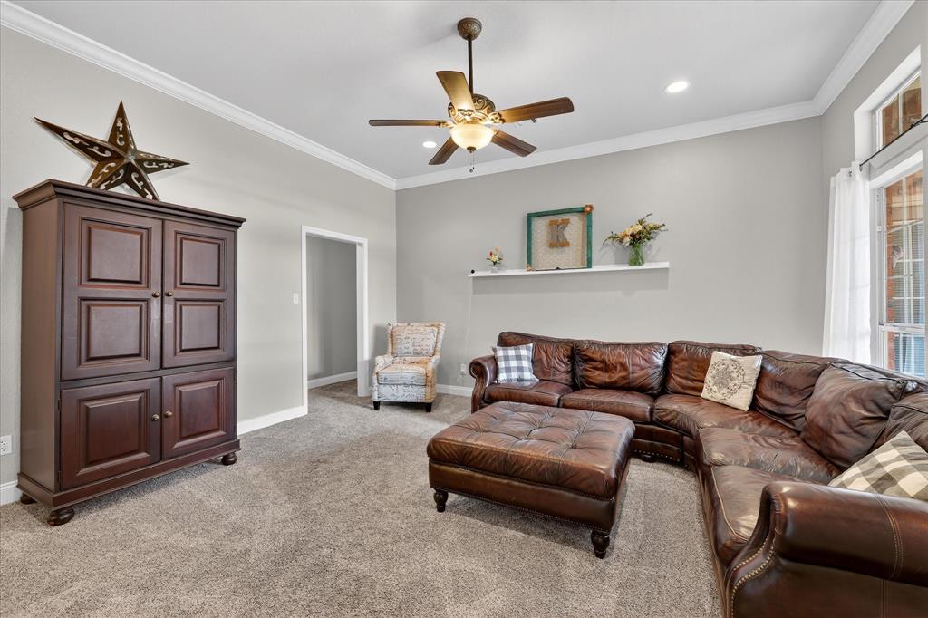 703 Gibraltar Lane Lorena, TX 76655 - Photo 23 of 39 a living room with furniture a ceiling fan and a window