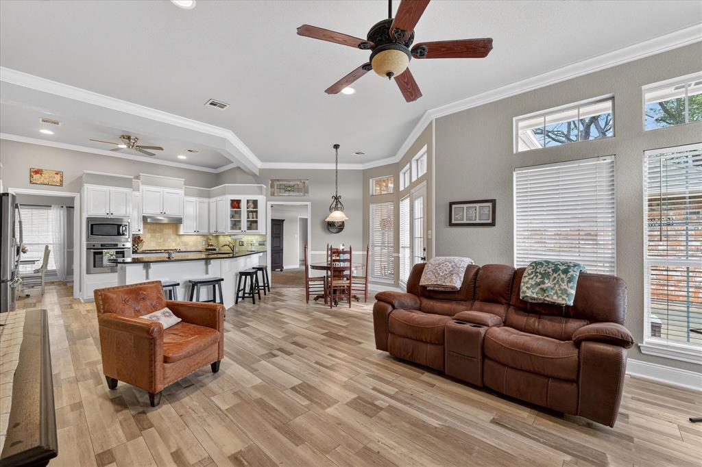 703 Gibraltar Lane Lorena, TX 76655 - Photo 27 of 39 a living room with furniture kitchen view and a window