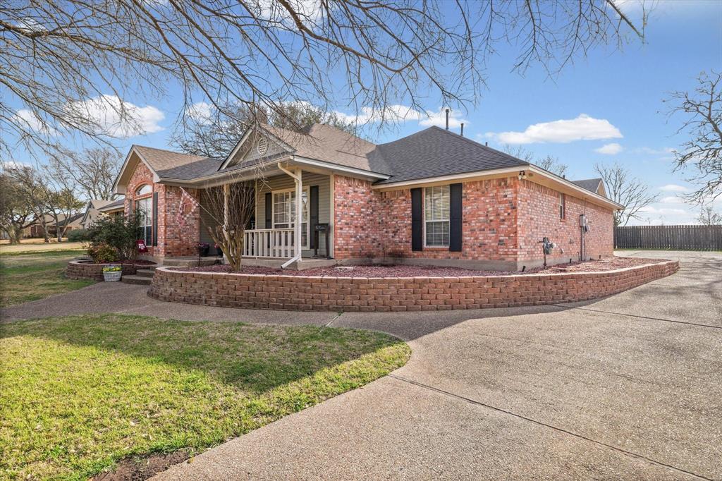 703 Gibraltar Lane Lorena, TX 76655 - Photo 3 of 39 a front view of a house with garden