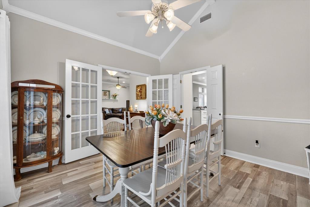 703 Gibraltar Lane Lorena, TX 76655 - Photo 31 of 39 a dining room with furniture and wooden floor