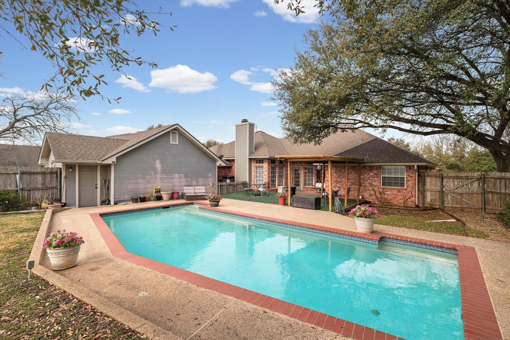 703 Gibraltar Lane Lorena, TX 76655 - Photo 37 of 39 swimming pool view with a seating space and a garden view