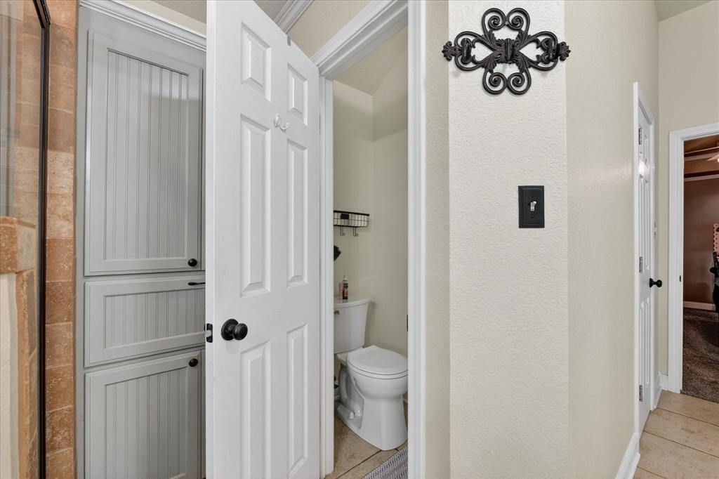 703 Gibraltar Lane Lorena, TX 76655 - Photo 8 of 39 a bathroom with a toilet and a sink