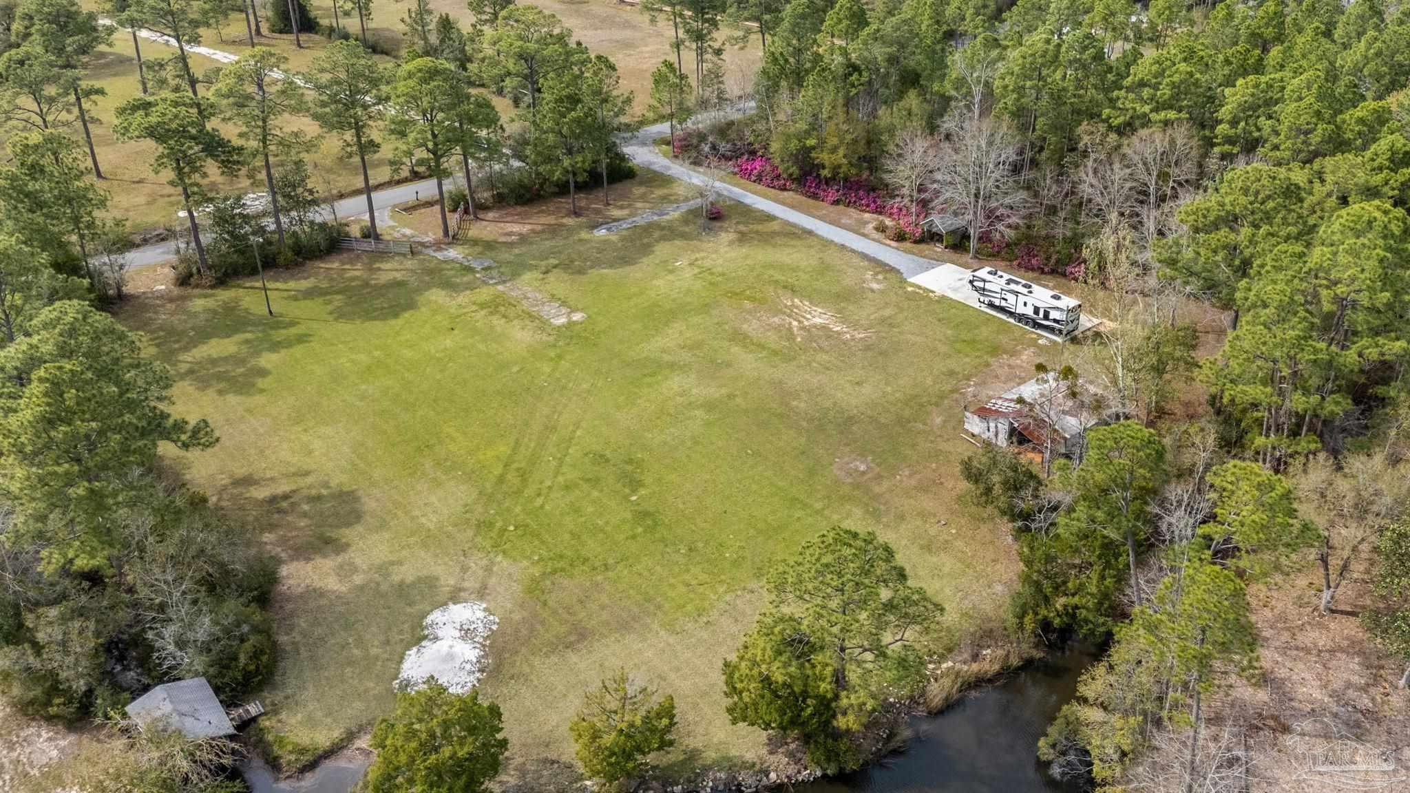 7524 Petersen Point Road Milton, FL 32583 - Photo 18 of 26 a view of swimming pool with a yard