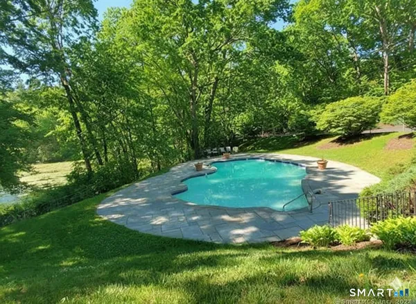 a view of a garden with a lake
