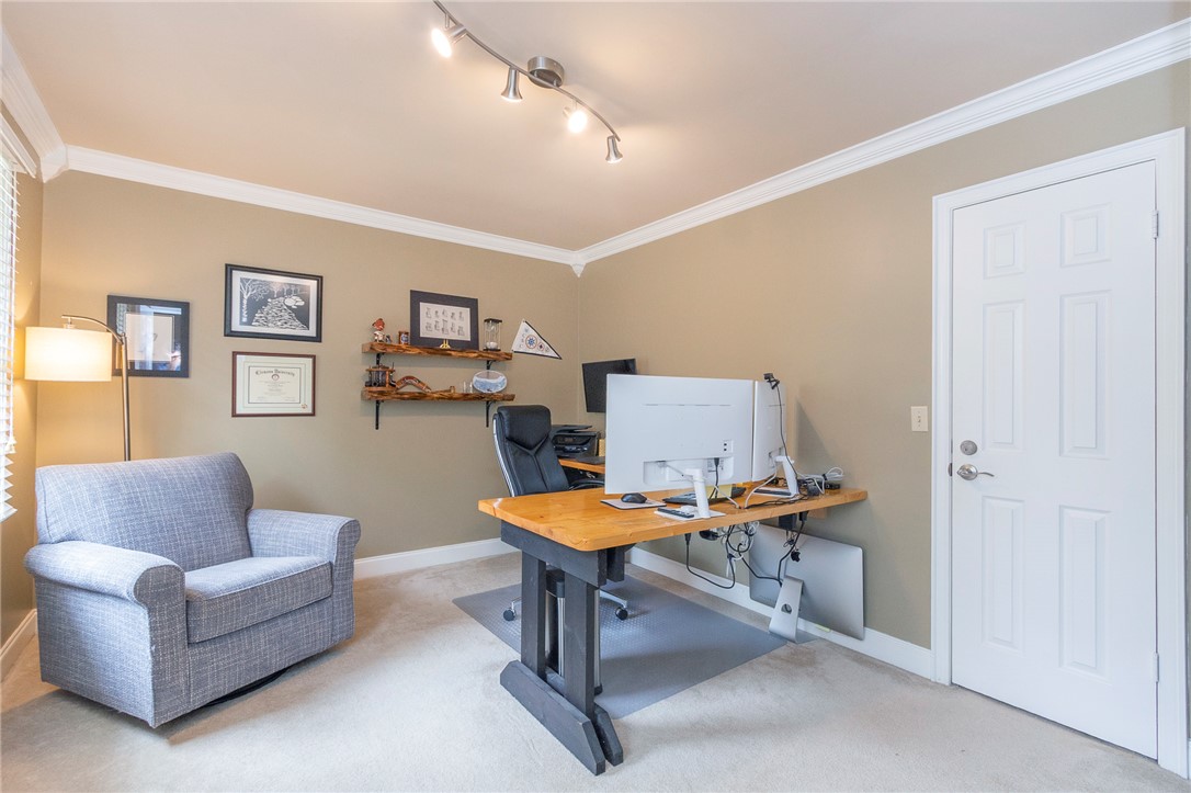 203 Oak Hollow Pendleton, SC 29670 - Photo 26 of 50 Well-appointed home office space featuring track lighting and crown molding for a productive environment.