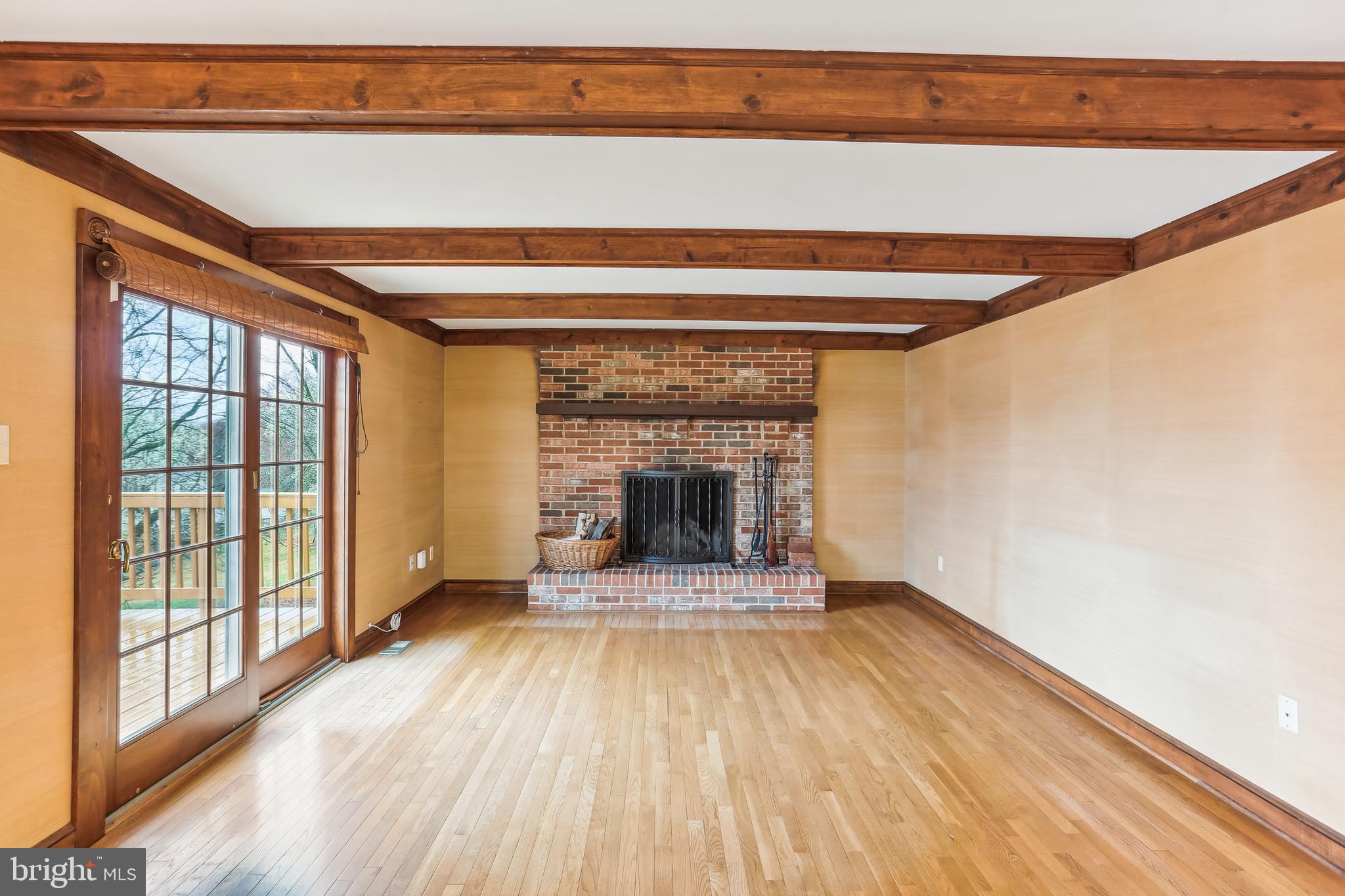 9730 Wightman Road Gaithersburg, MD 20882 - Photo 30 of 64 Family room with wood-burning fireplace.