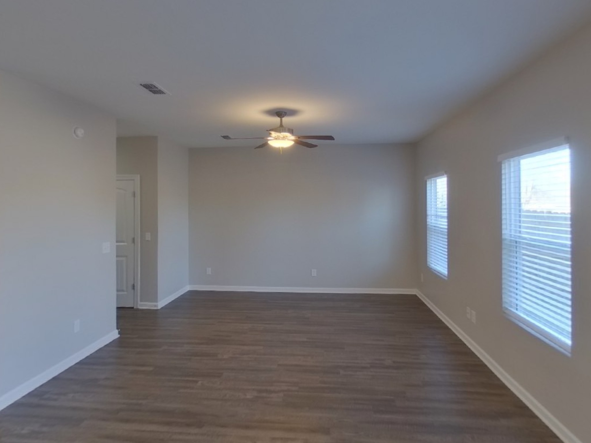 2243 Lismore Drive Murfreesboro, TN 37130 - Photo 2 of 15 a view of an empty room with wooden floor and a window