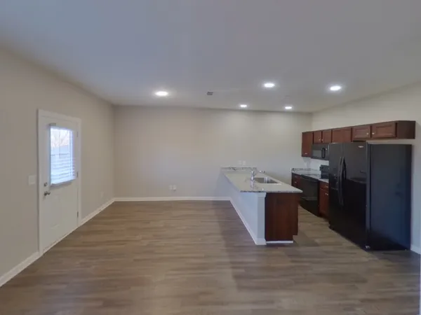 an empty room with wooden floor